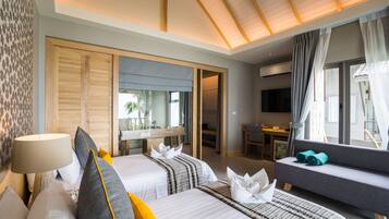 Beachfront Deluxe Villa | Een minibar, een kluis op de kamer, verduisterende gordijnen