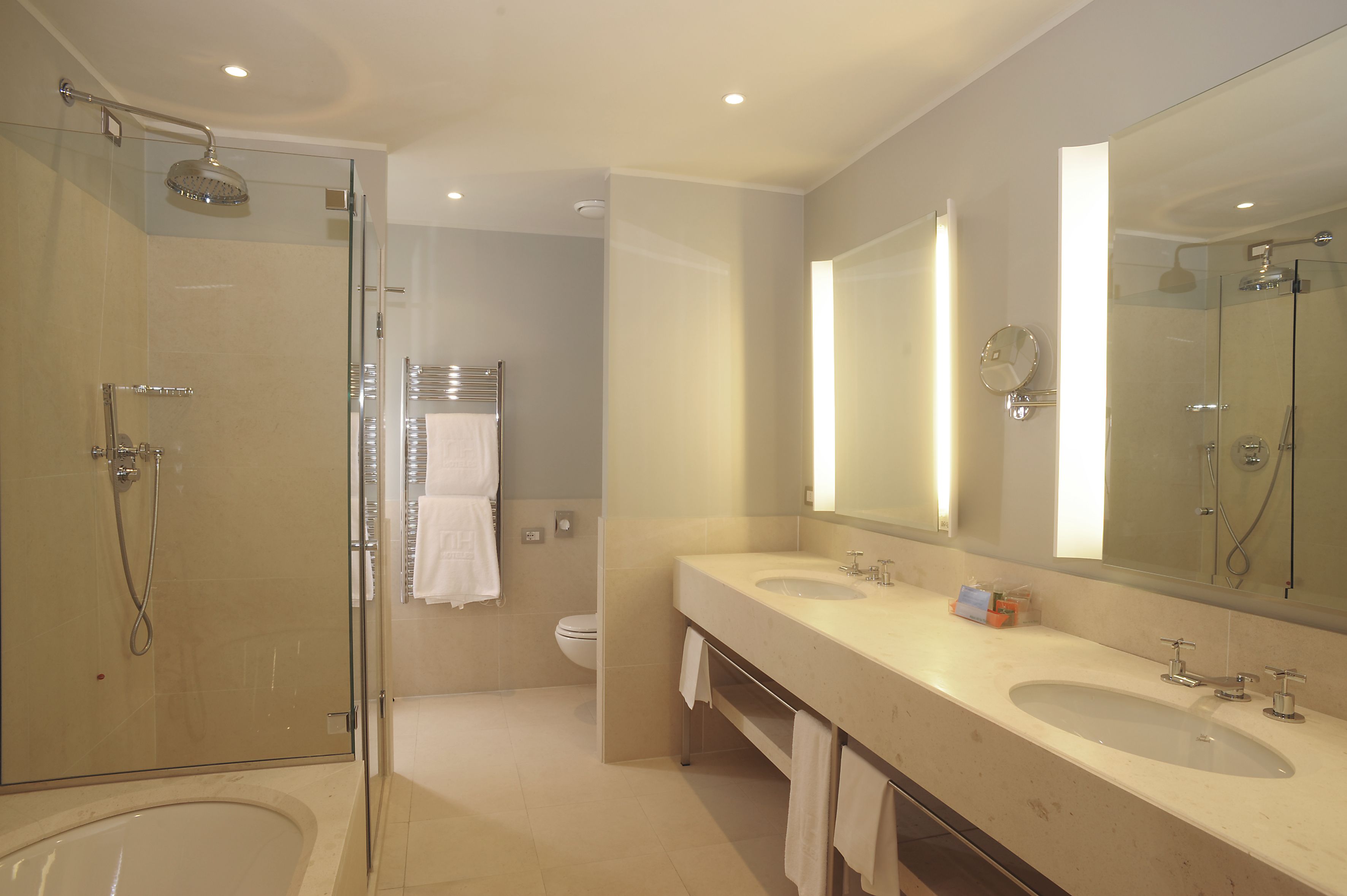 deep-soaking bathtub, rainfall showerhead, eco-friendly toiletries