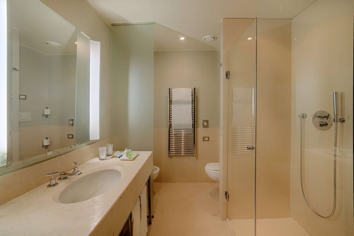 deep-soaking bathtub, rainfall showerhead, eco-friendly toiletries