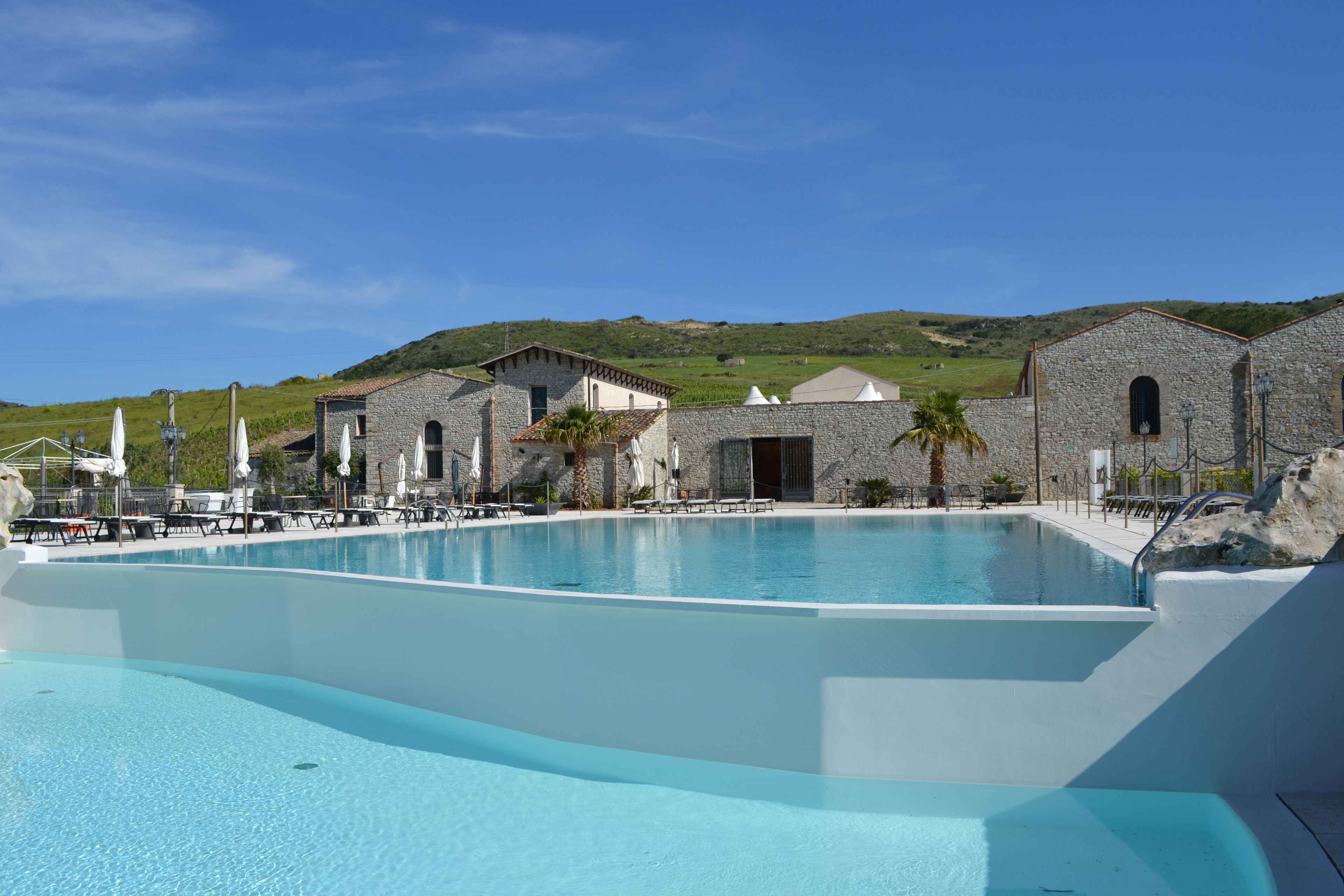 2 outdoor pools, open 10 AM to 7 PM, pool umbrellas, pool loungers