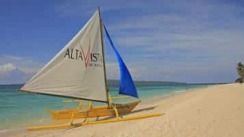 Beach nearby, white sand, beach umbrellas, beach towels