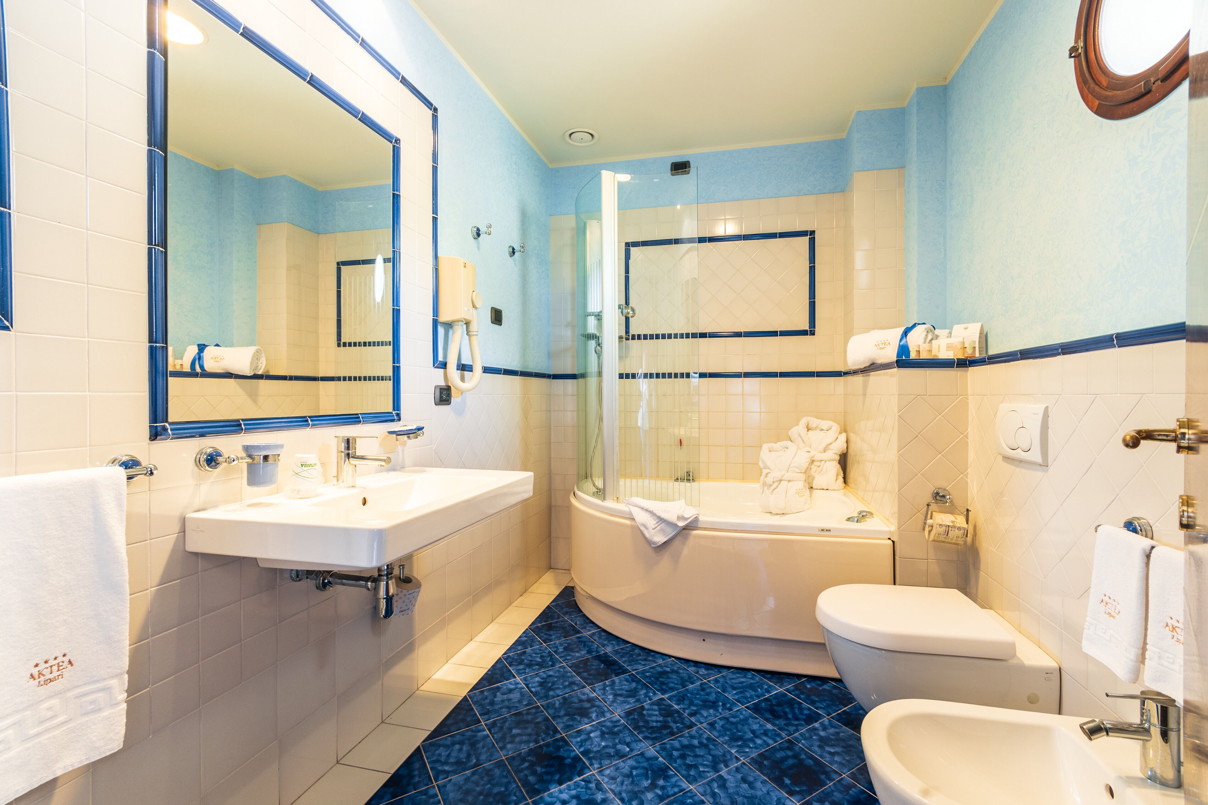 comfort double room, 1 double or 2 single beds, pool view | bathroom | combined shower/bathtub, free toiletries, hair dryer, slippers