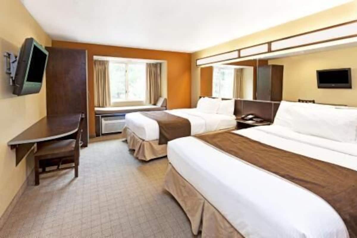 Premium bedding, pillowtop beds, desk, laptop workspace