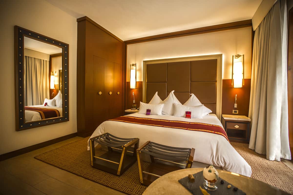 Hypo-allergenic bedding, down comforters, minibar, in-room safe