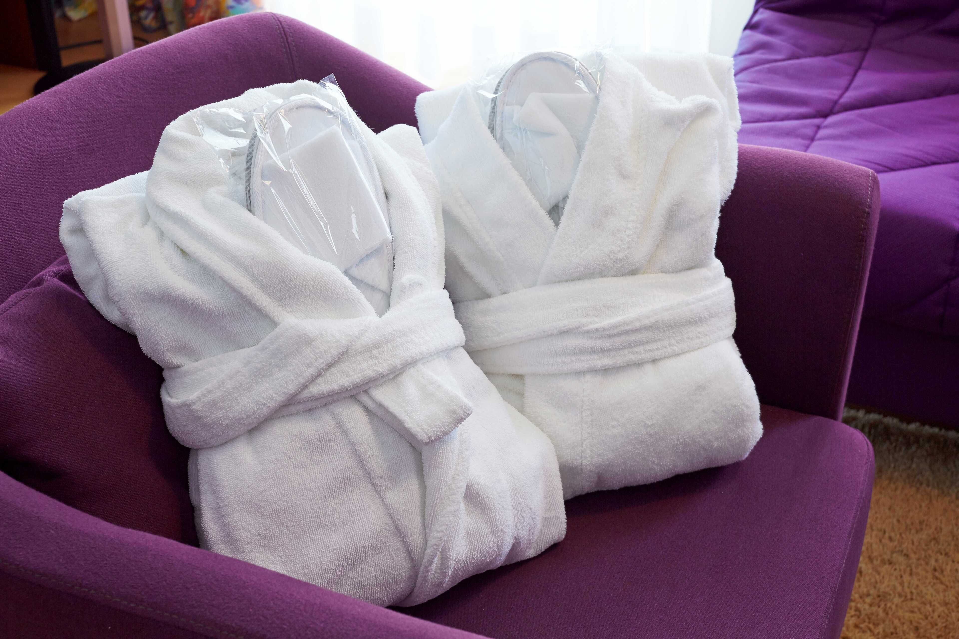 hair dryer, slippers, bidet, towels