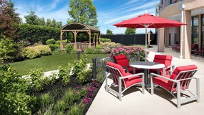 A patio area with outdoor seating and a gazebo.