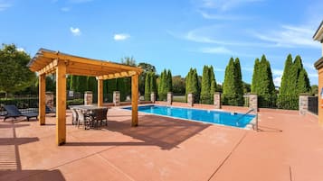 Seasonal outdoor pool, pool loungers