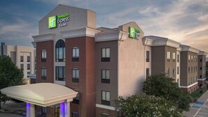 Edificio de Holiday Inn Express & Suites con un diseño moderno, que presenta fachada de ladrillo y ventanas amplias.