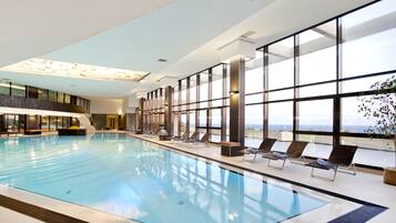 Indoor pool, outdoor pool, pool umbrellas, pool loungers