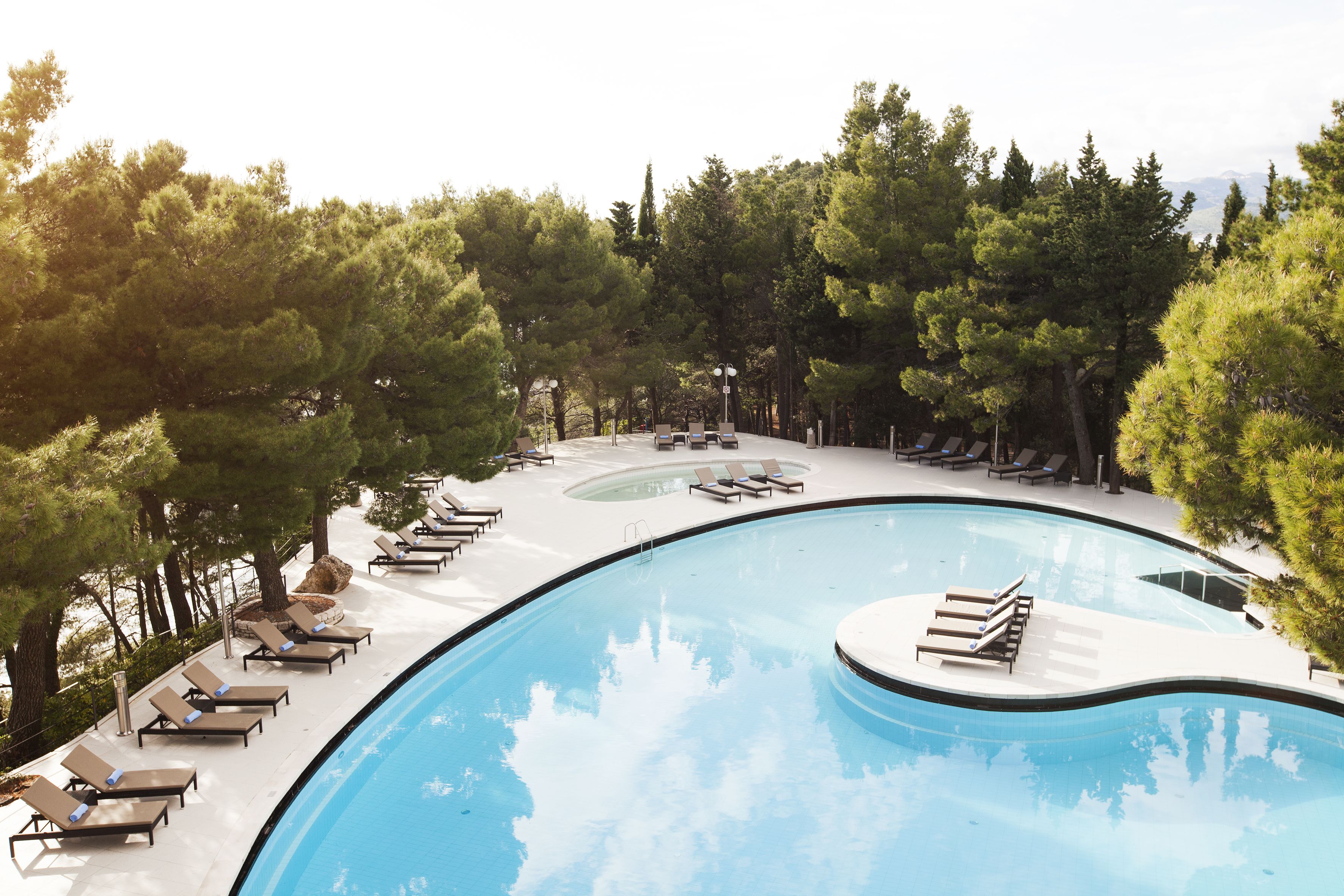 indoor pool, outdoor pool, pool umbrellas, pool loungers