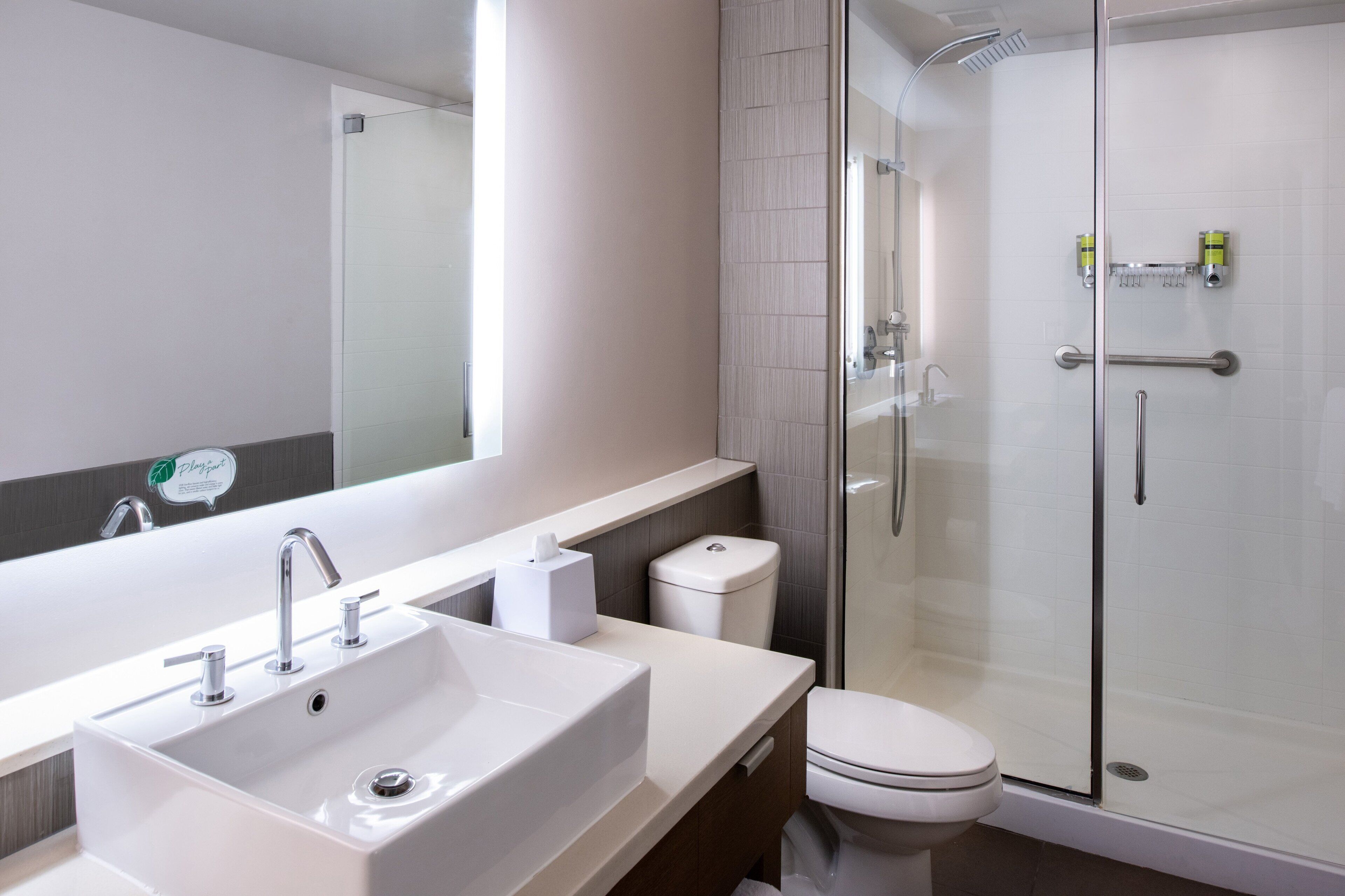 designer toiletries, hair dryer, towels