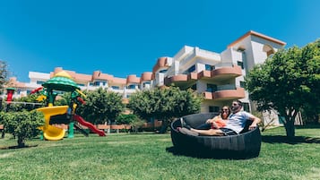 Residents can enjoy a leisurely atmosphere on their balcony or relax in the adjacent grassy lawn with a children's play area.