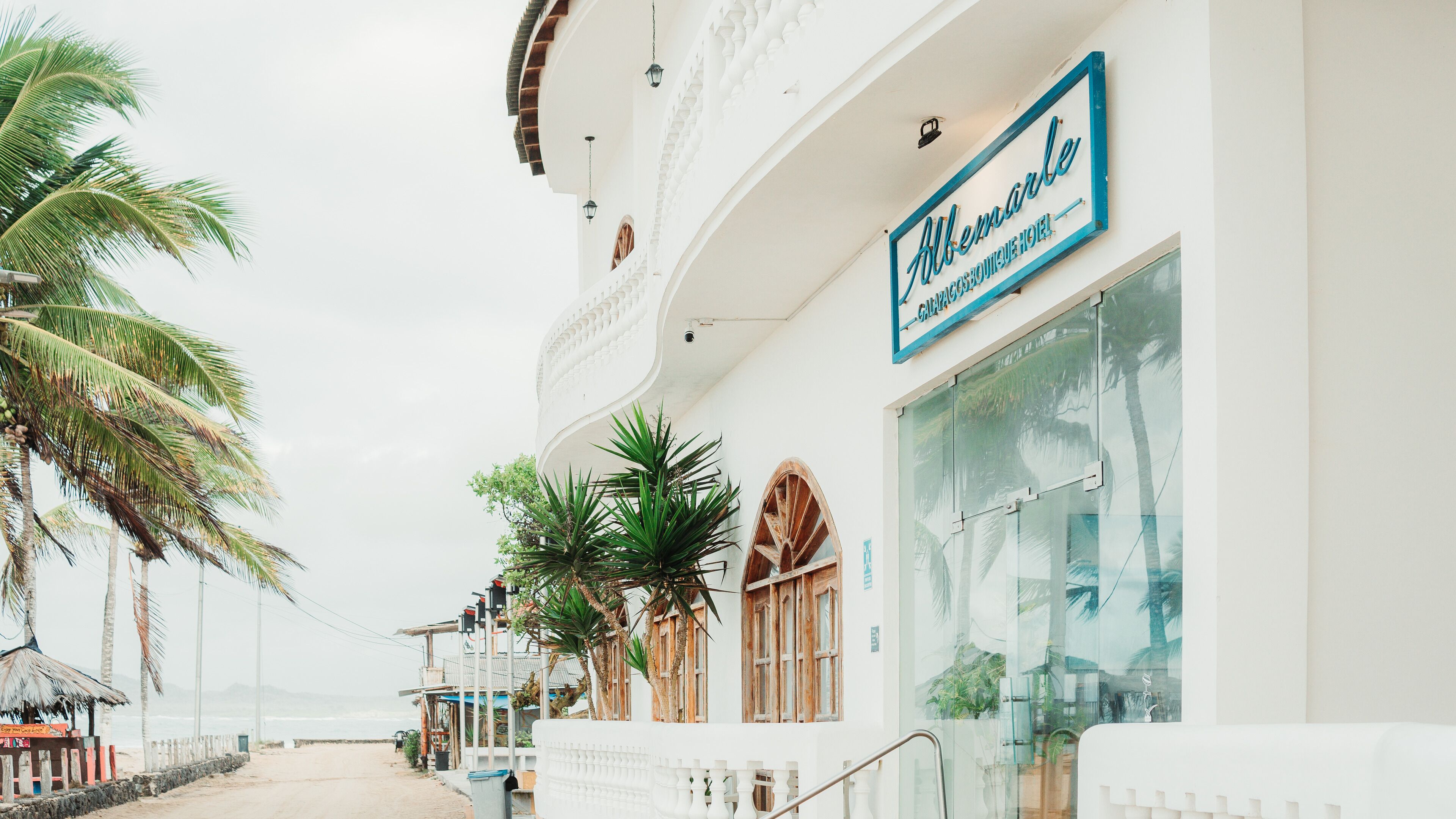 A hotel with a sign reading "Albemarle Galapagos Boutique Hotel".
