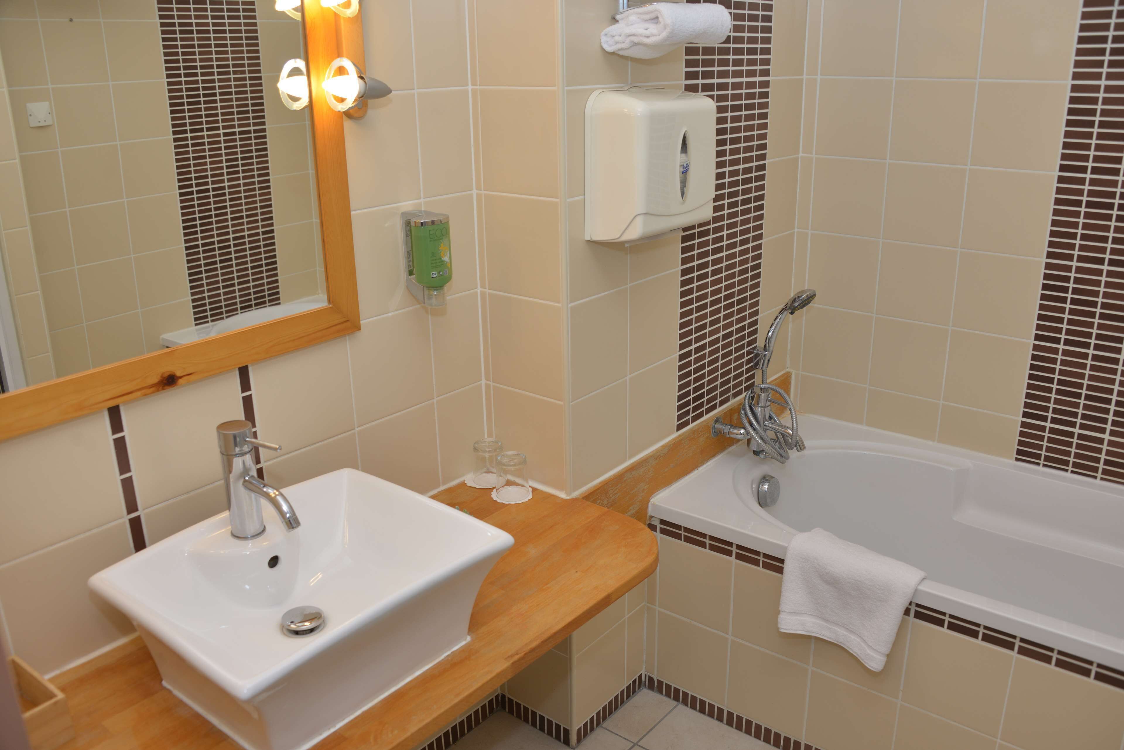 separate bathtub and shower, free toiletries, hair dryer, towels