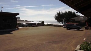 A parking area with a view of the ocean. - Surf Inn (Gualala)