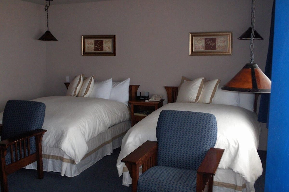 premium bedding, blackout curtains, iron/ironing board, bed sheets