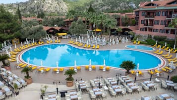 Indoor pool, 2 outdoor pools, open 8:00 AM to 7:00 PM, pool umbrellas