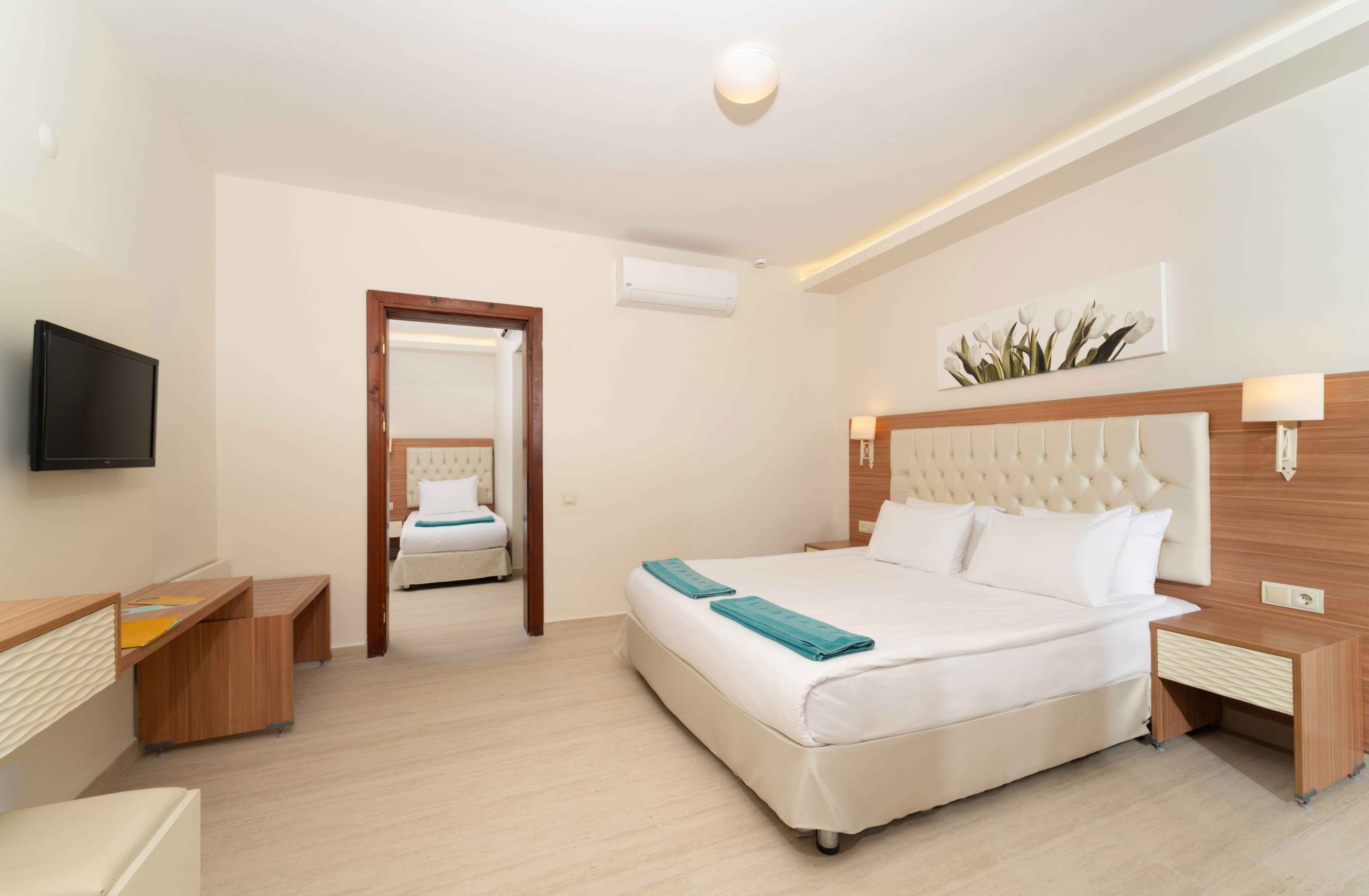 Family Room | Free minibar, in-room safe, desk, soundproofing