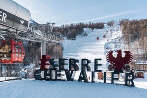 Welcome to Serrre Chevalier, where a ski lift awaits, offering access to the slopes.