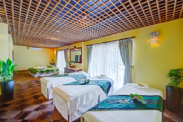 A room with three beds, a large potted plant, and a ceiling with a wooden lattice design. - Sokha Beach Resort (Sihanoukville)