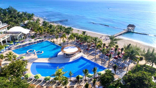 A resort with a large swimming pool, beach access, and palm trees. - The Fives Beach Hotel - Á la Carte All Inclusive (Playa del Carmen)
