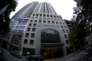 A high-rise building with the sign "BSA SUITES" indicating it is a hotel. - BSA Suites Makati (Makati)