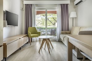 Apartment, 2 Bedrooms | Living area | 31-inch flat-screen TV with satellite channels, TV