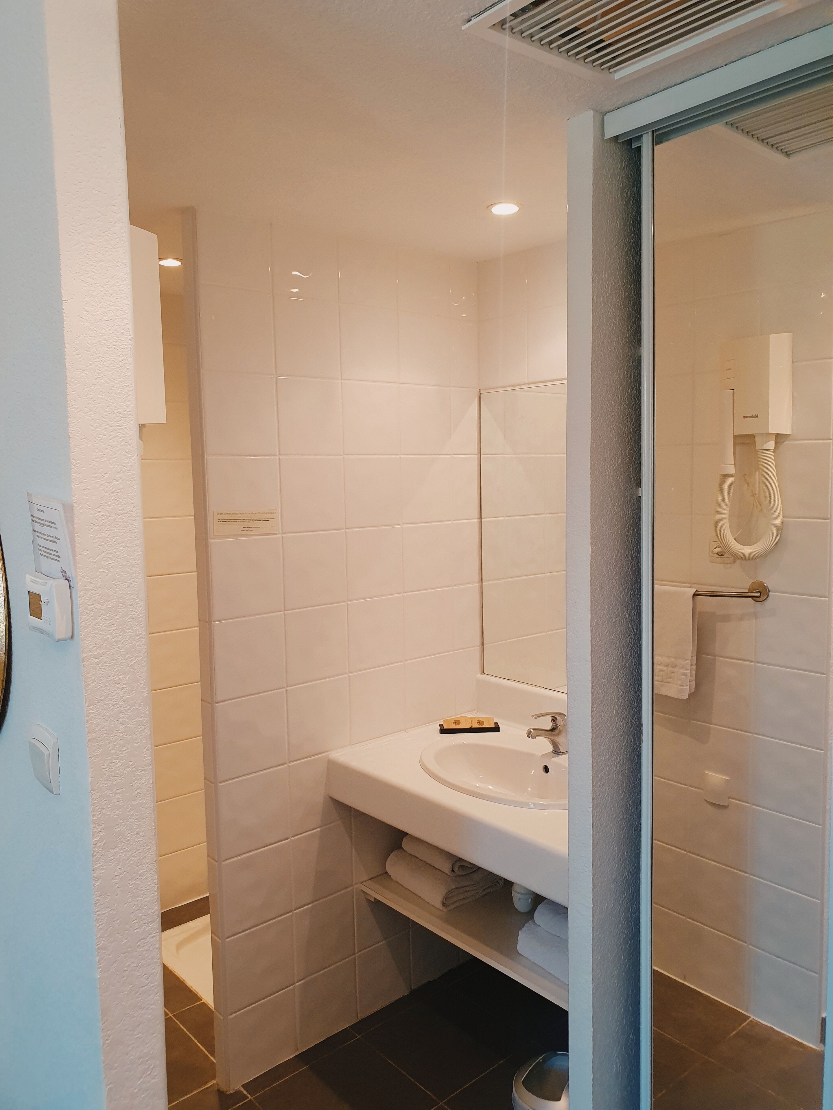 shower, free toiletries, hair dryer, towels