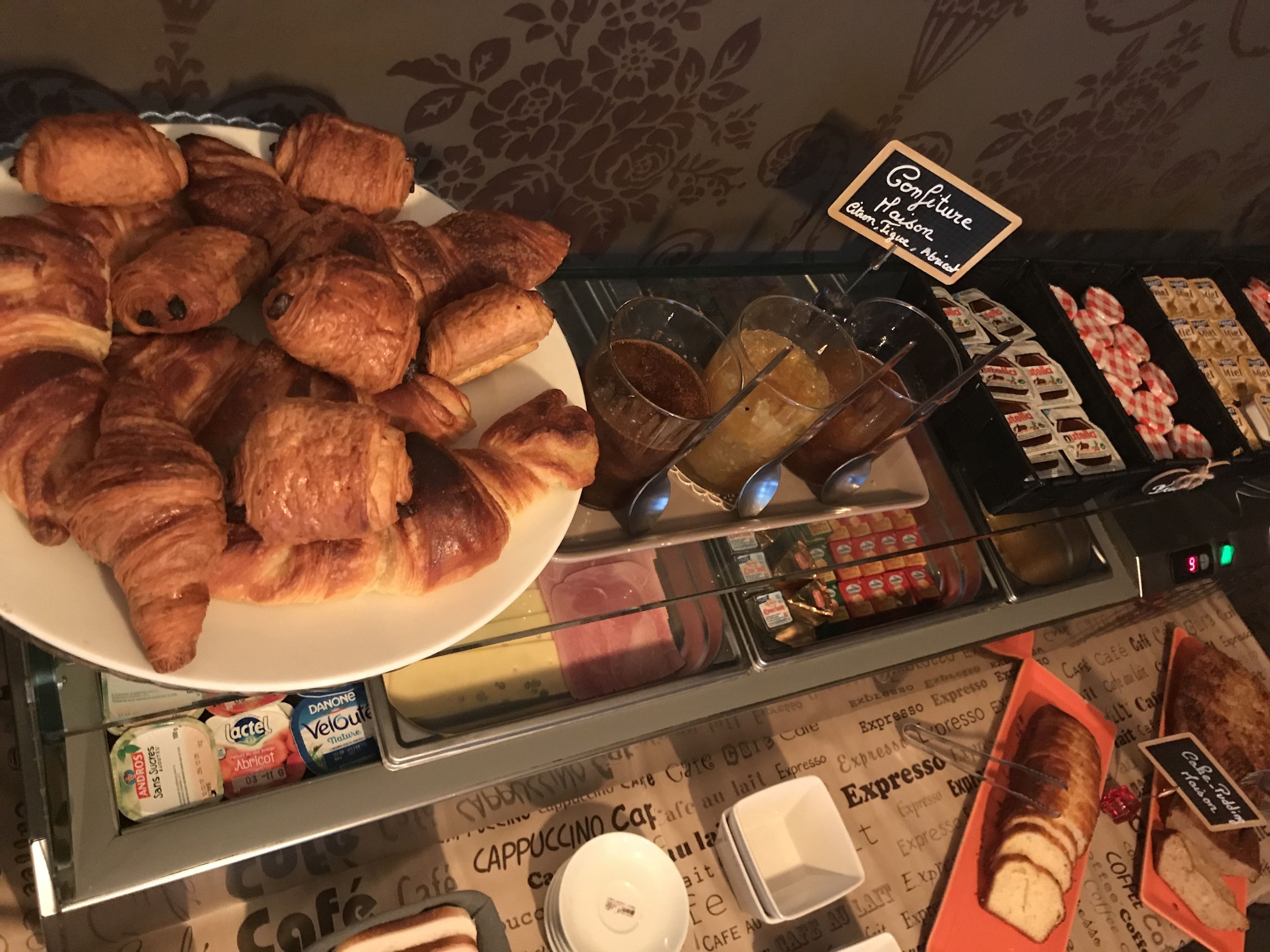 A display of pastries and beverages in a café setting.