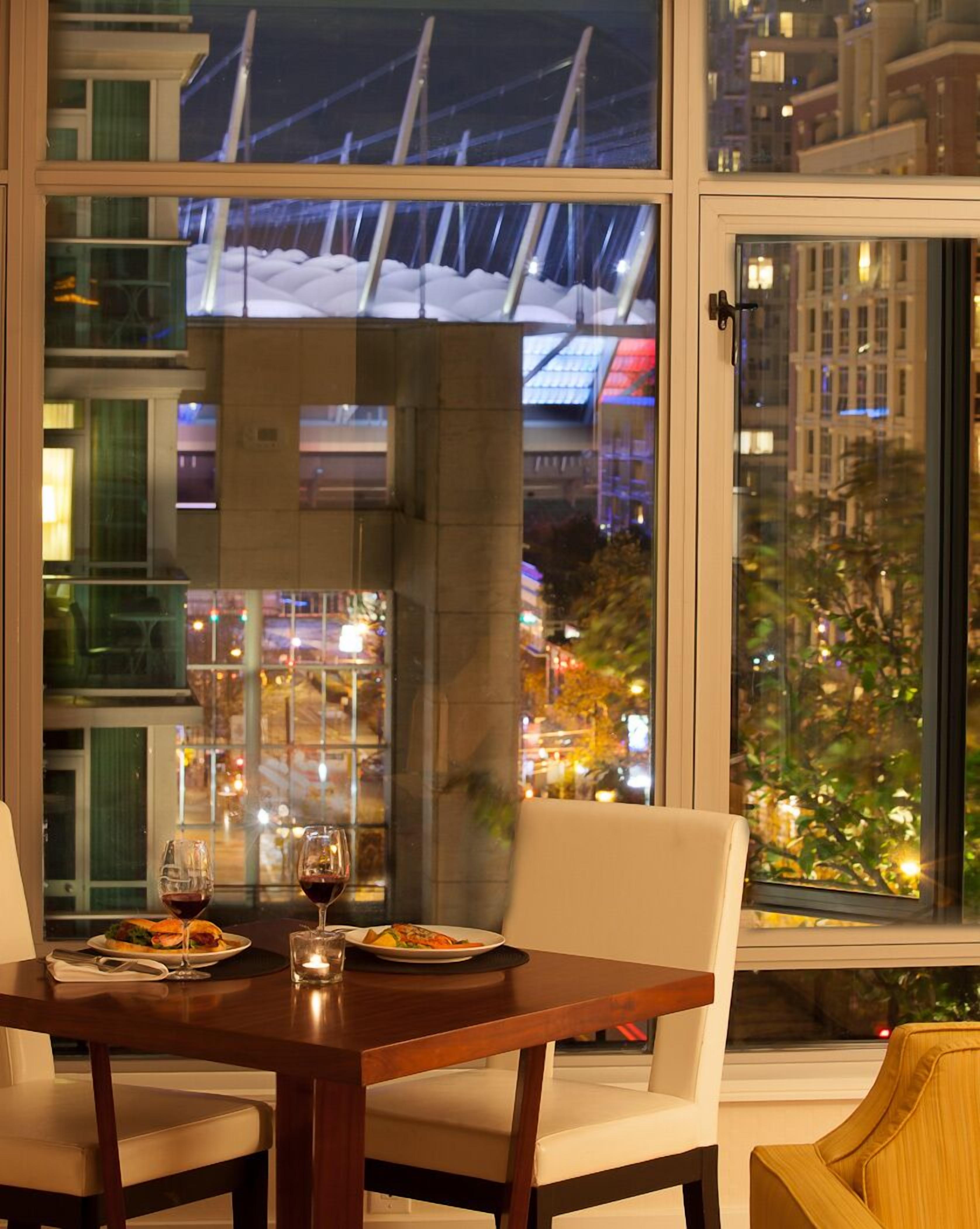 Signature Suite, 1 Bedroom | Living area | 48-inch LED TV with cable channels, TV, iPod dock