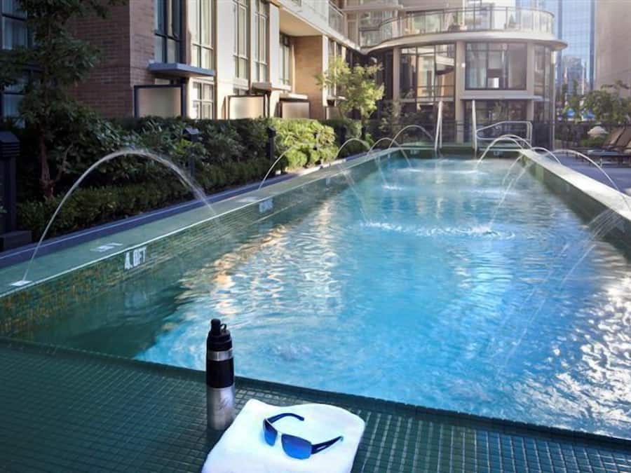 Outdoor pool, open 7:00 AM to 10:00 PM, pool loungers