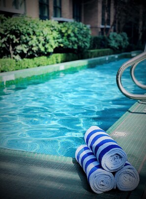Outdoor pool, open 7:00 AM to 10:00 PM, sun loungers