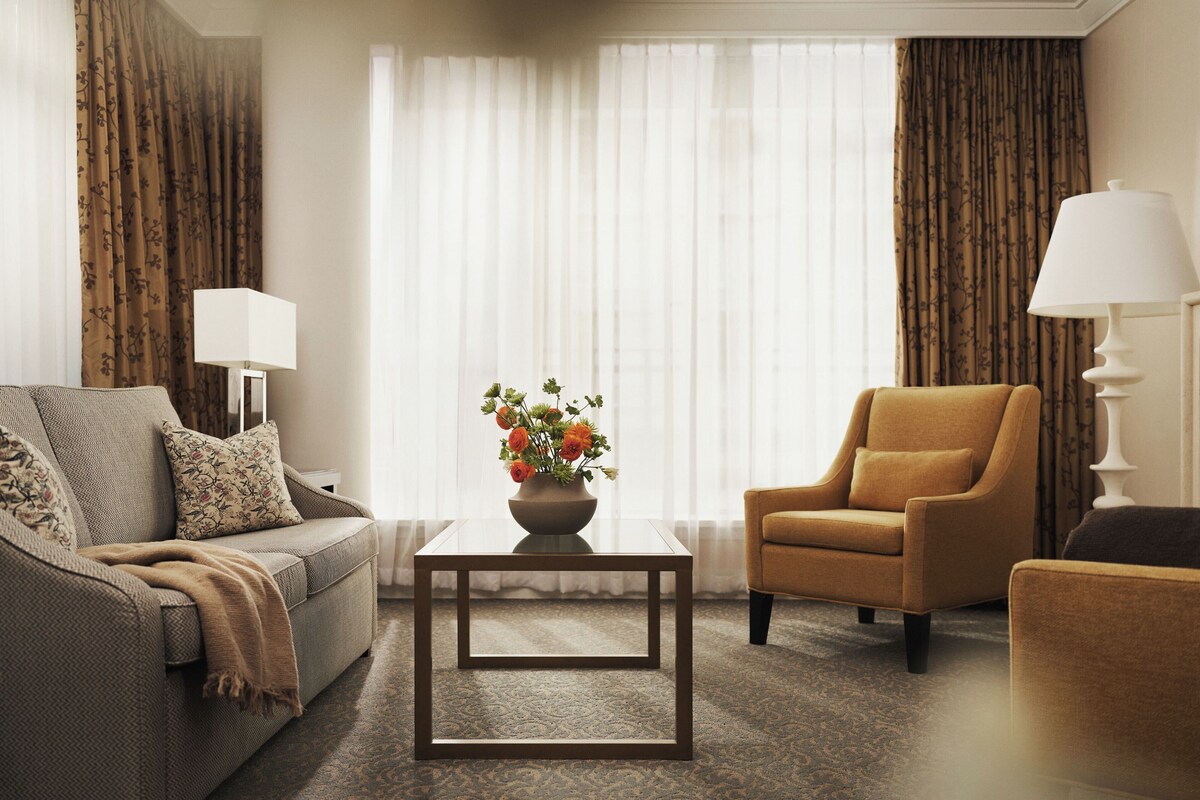 One Bedroom Boutique Suite | Living area | 48-inch LED TV with cable channels, TV