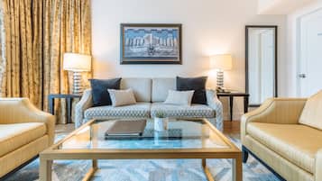 Signature Suite, 1 Bedroom | Living area | 48-inch LED TV with cable channels, TV, iPod dock