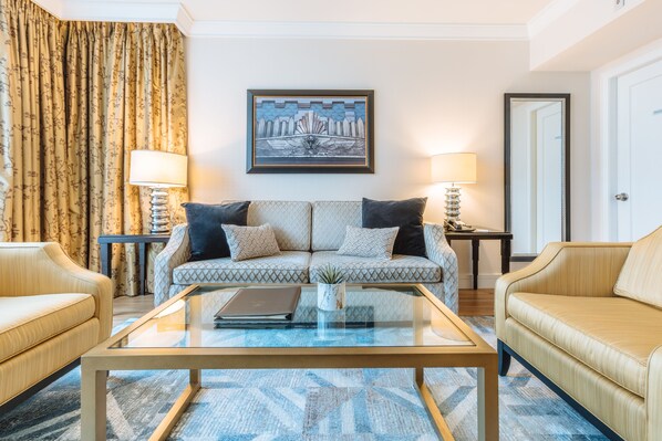 Signature Suite, 1 Bedroom | Living area | 48-inch LED TV with cable channels, TV, iPod dock