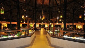 A buffet area with a 'Desserts' section, a thatched roof, and hanging lanterns. - Southern Palms Beach Resort (Diani Beach)