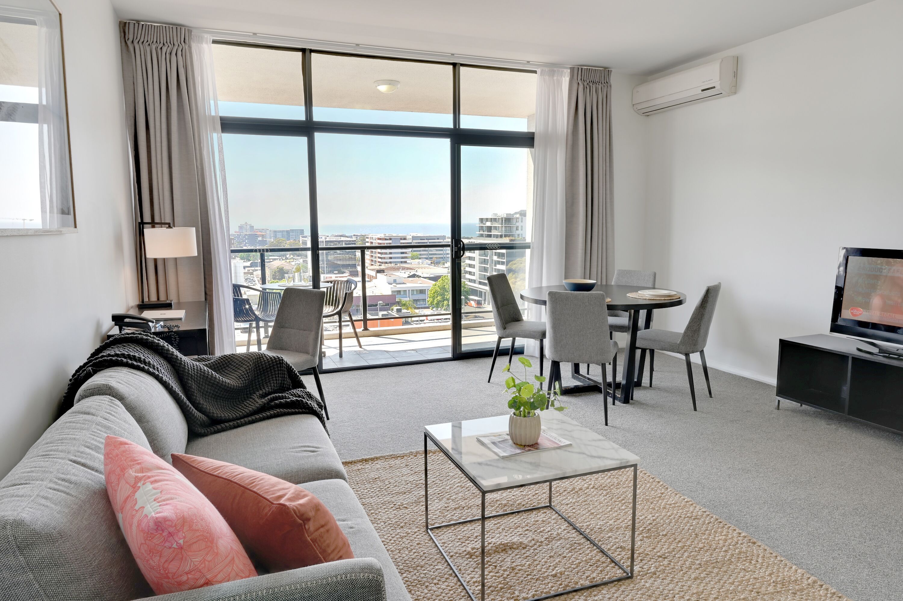 One Bedroom Deluxe Apartment | Living area | 32-inch LCD TV with cable channels, TV