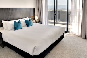One Bedroom Deluxe Apartment | Desk, laptop workspace, iron/ironing board, cribs/infant beds