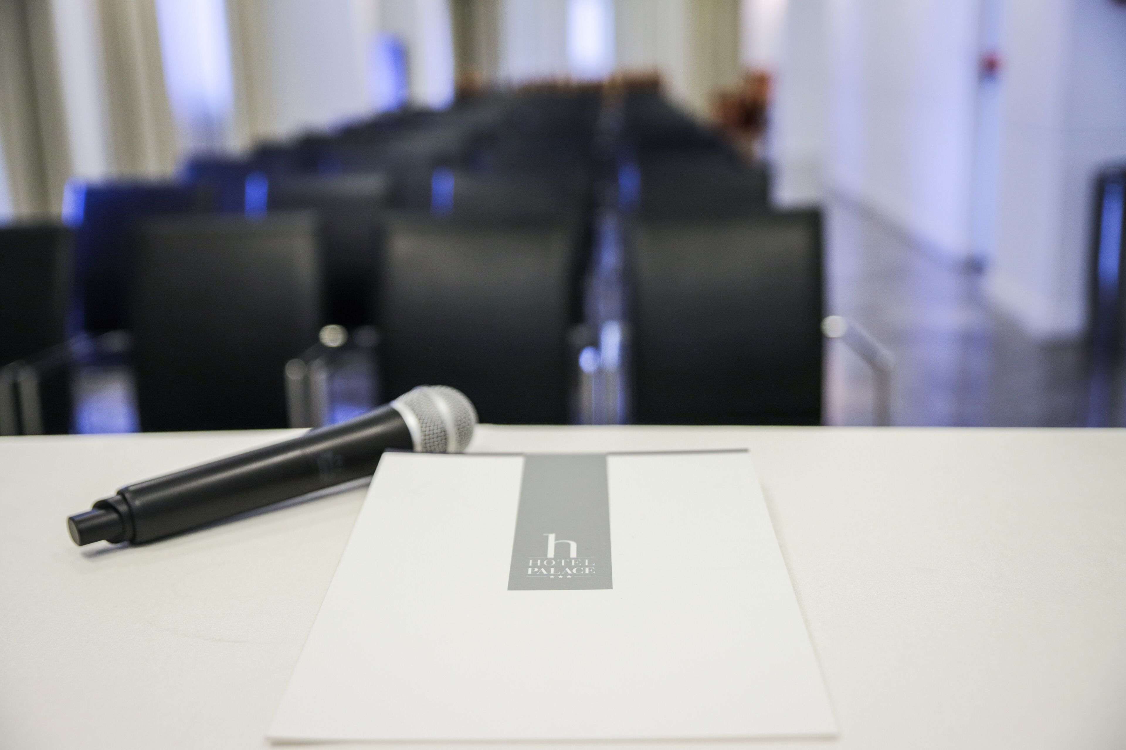 A microphone on a table with a hotel name tag.