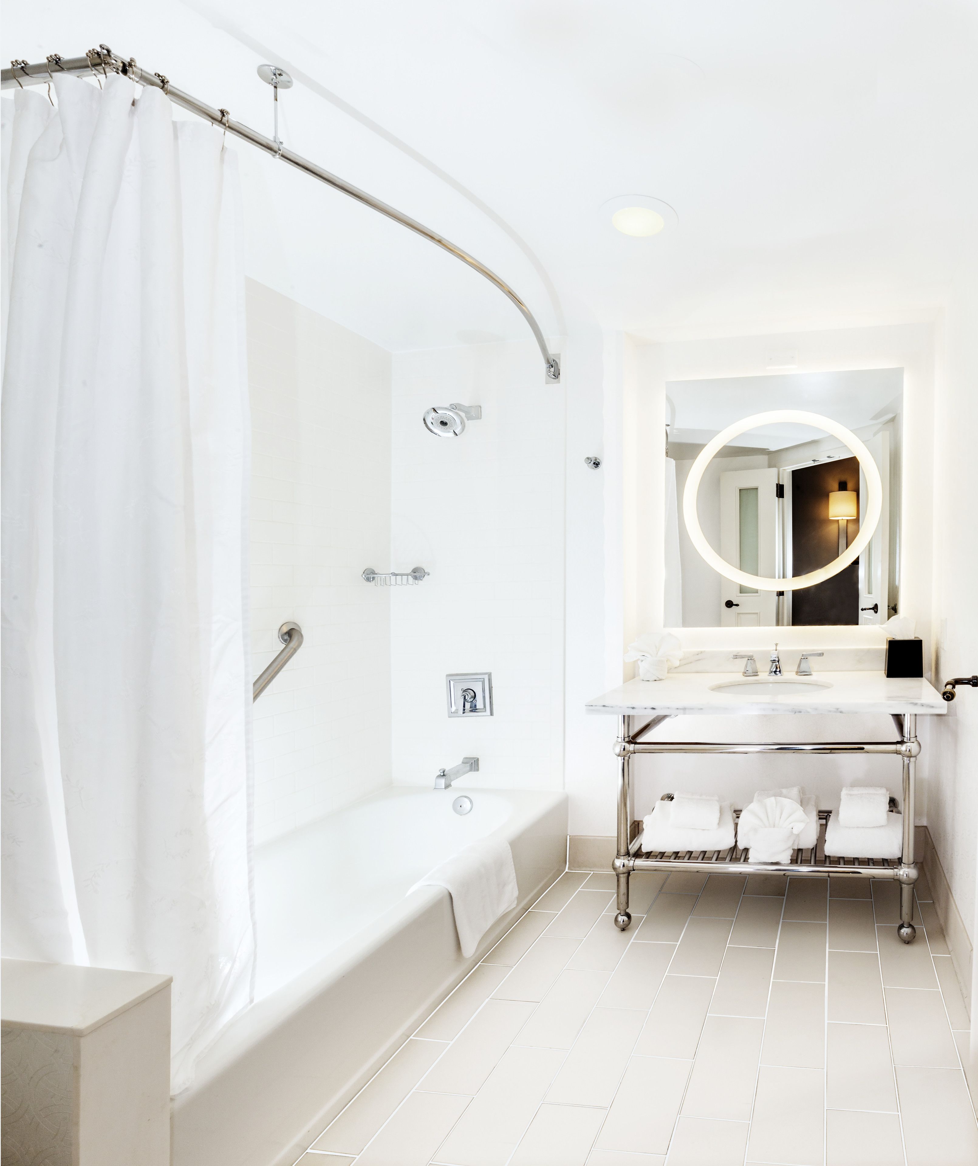 hydromassage showerhead, designer toiletries, hair dryer, towels