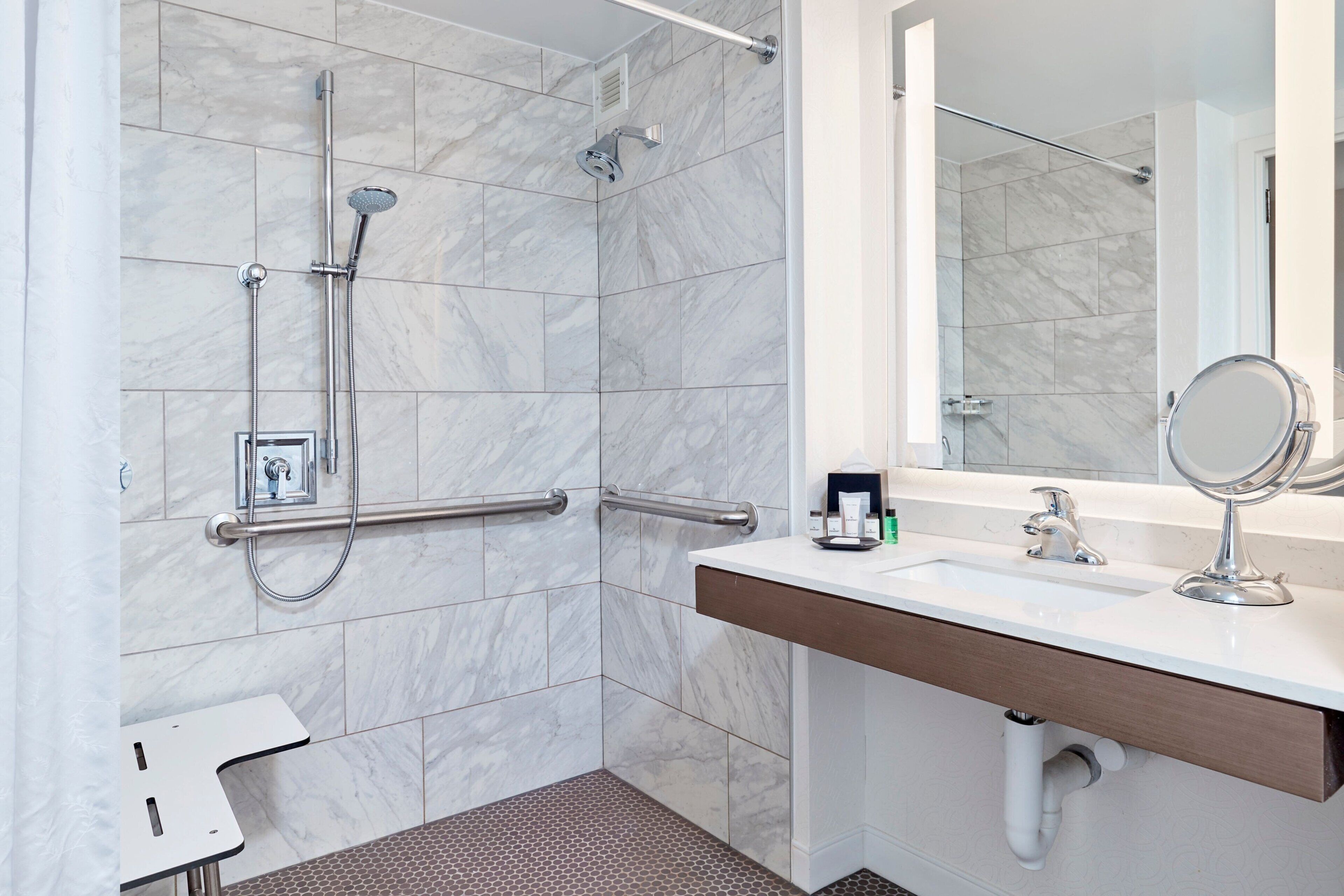 traditional room, 1 king bed (mobility/hearing access, roll-in shwr) | bathroom | hydromassage showerhead, designer toiletries, hair dryer, towels