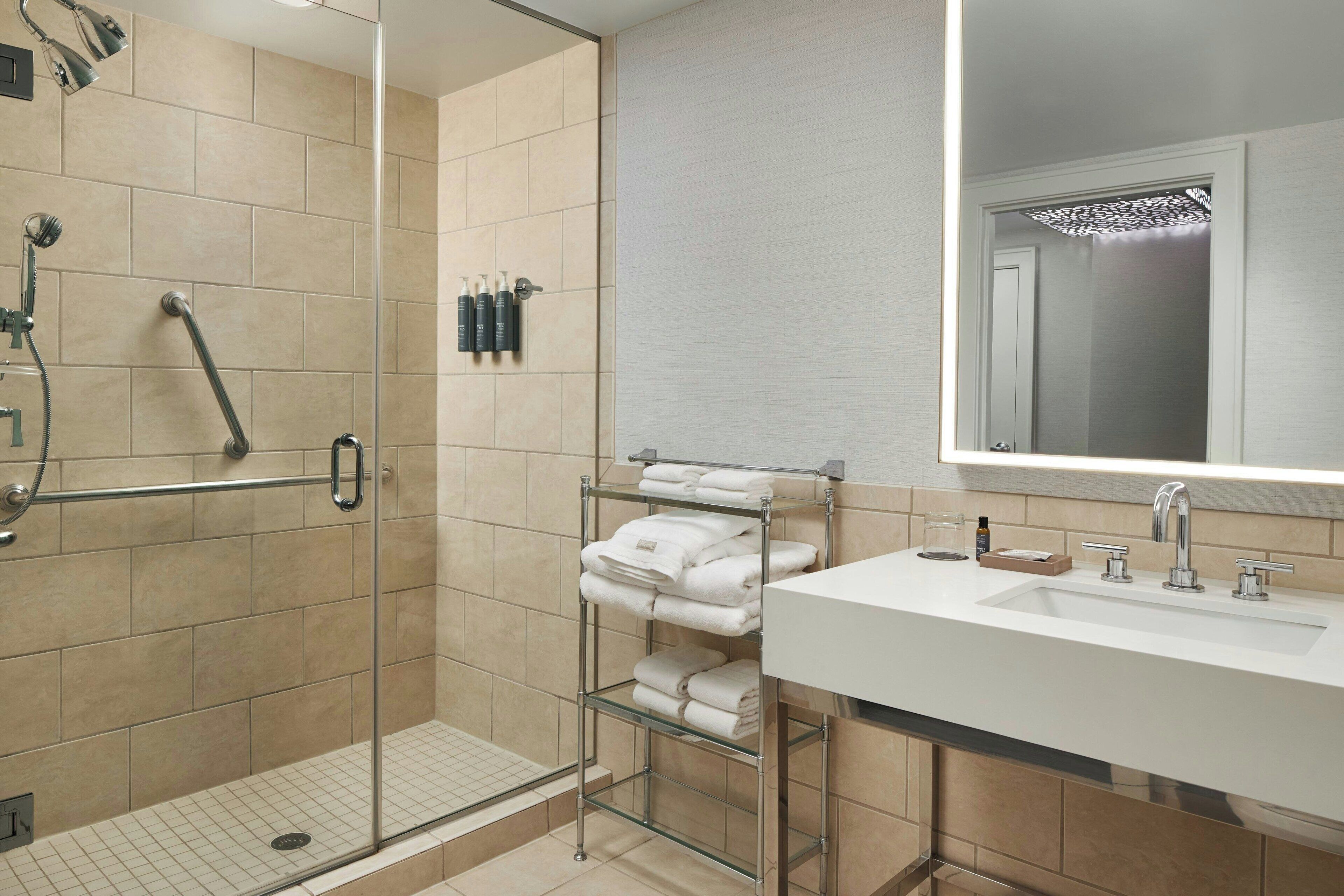 designer toiletries, hair dryer, bathrobes, towels