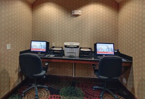 A conference room with two desks, each with a computer and a printer. - Holiday Inn Express & Suites Altus by IHG (Altus)