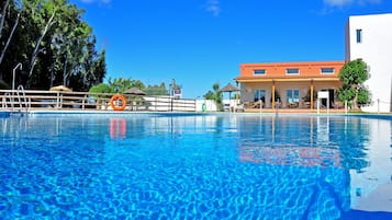 Seasonal outdoor pool, pool umbrellas, pool loungers