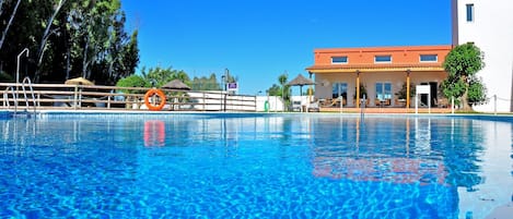 Seasonal outdoor pool, pool umbrellas, sun loungers