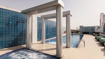 Outdoor pool, open 8:00 AM to 9:00 PM, pool loungers