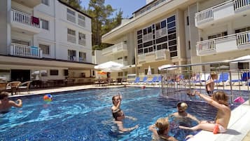 Outdoor pool, pool umbrellas, sun loungers