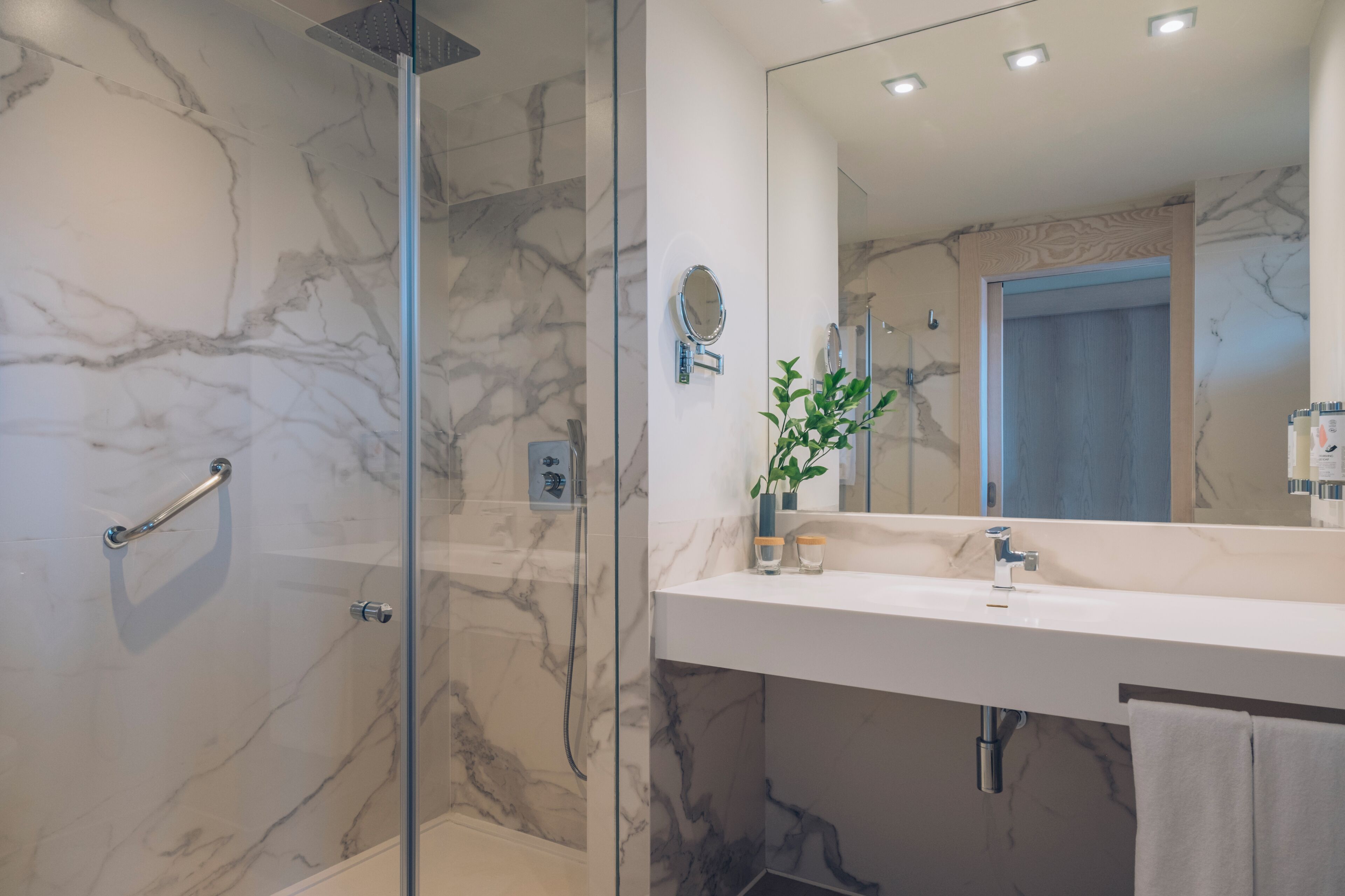 bathtub, eco-friendly toiletries, hair dryer, bathrobes