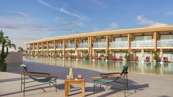 A hotel with a pool area, lounge chairs, and a table with drinks.