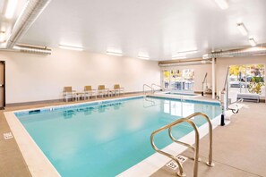 Indoor pool, open 6:00 AM to 10:00 PM, pool loungers